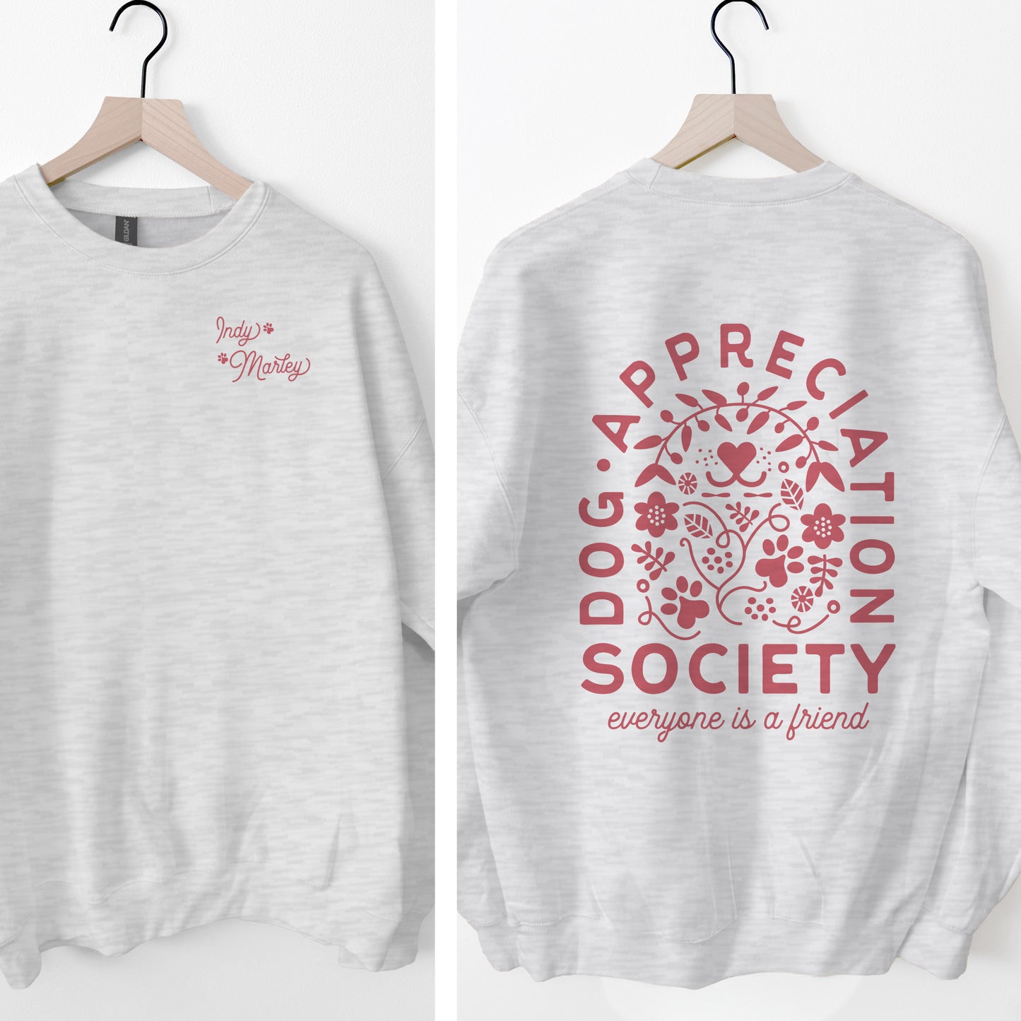 Gray sweatshirt with pink 'Dog Appreciation Society' design on a white background