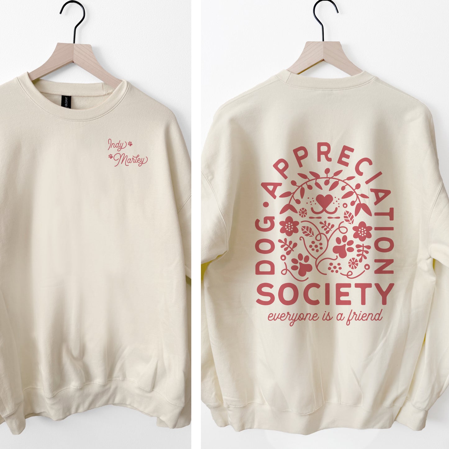 Beige sweatshirt with red text and graphics on a white background