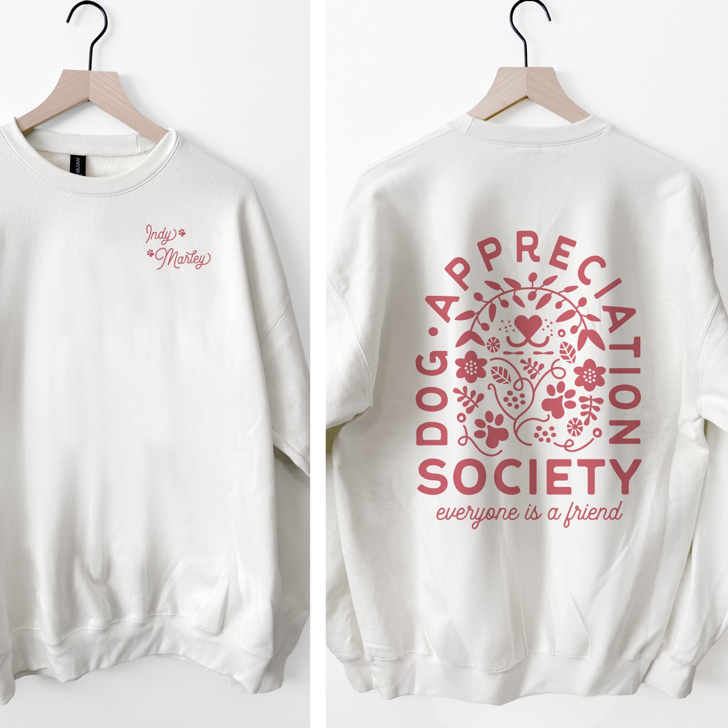White sweatshirt with pink 'Dog Appreciation Society' design on a white background