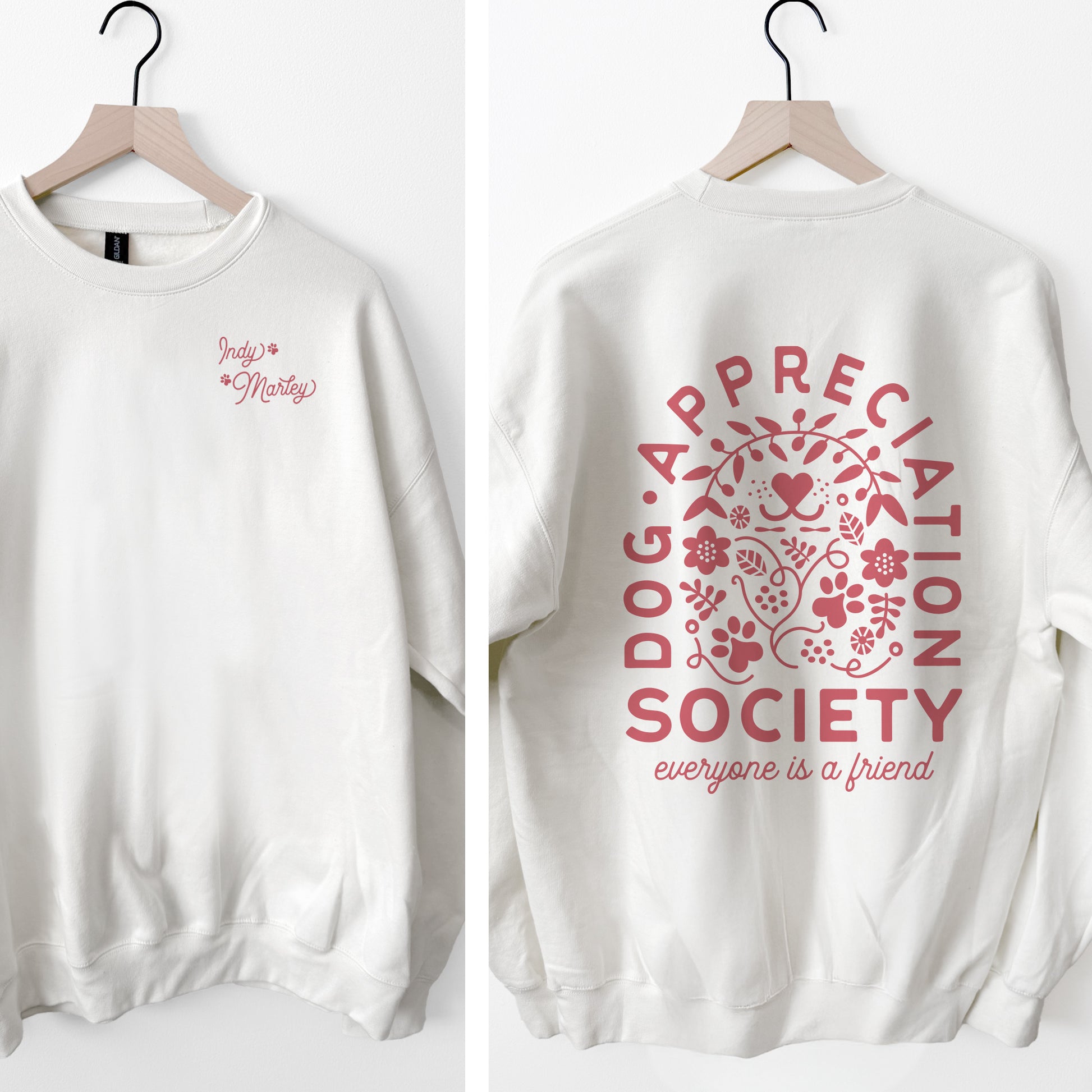 White sweatshirt with pink 'Dog Appreciation Society' design on a white background
