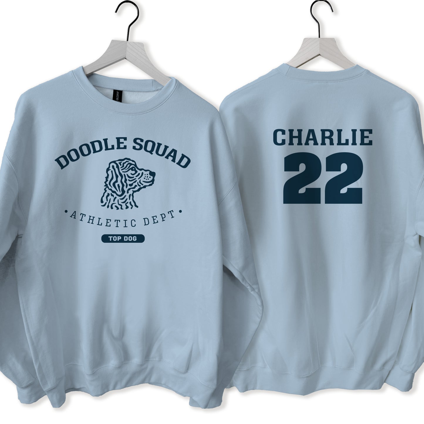 Light blue sweatshirt with 'Doodle Squad Athletic Dept' and 'Charlie 22' text on hangers.