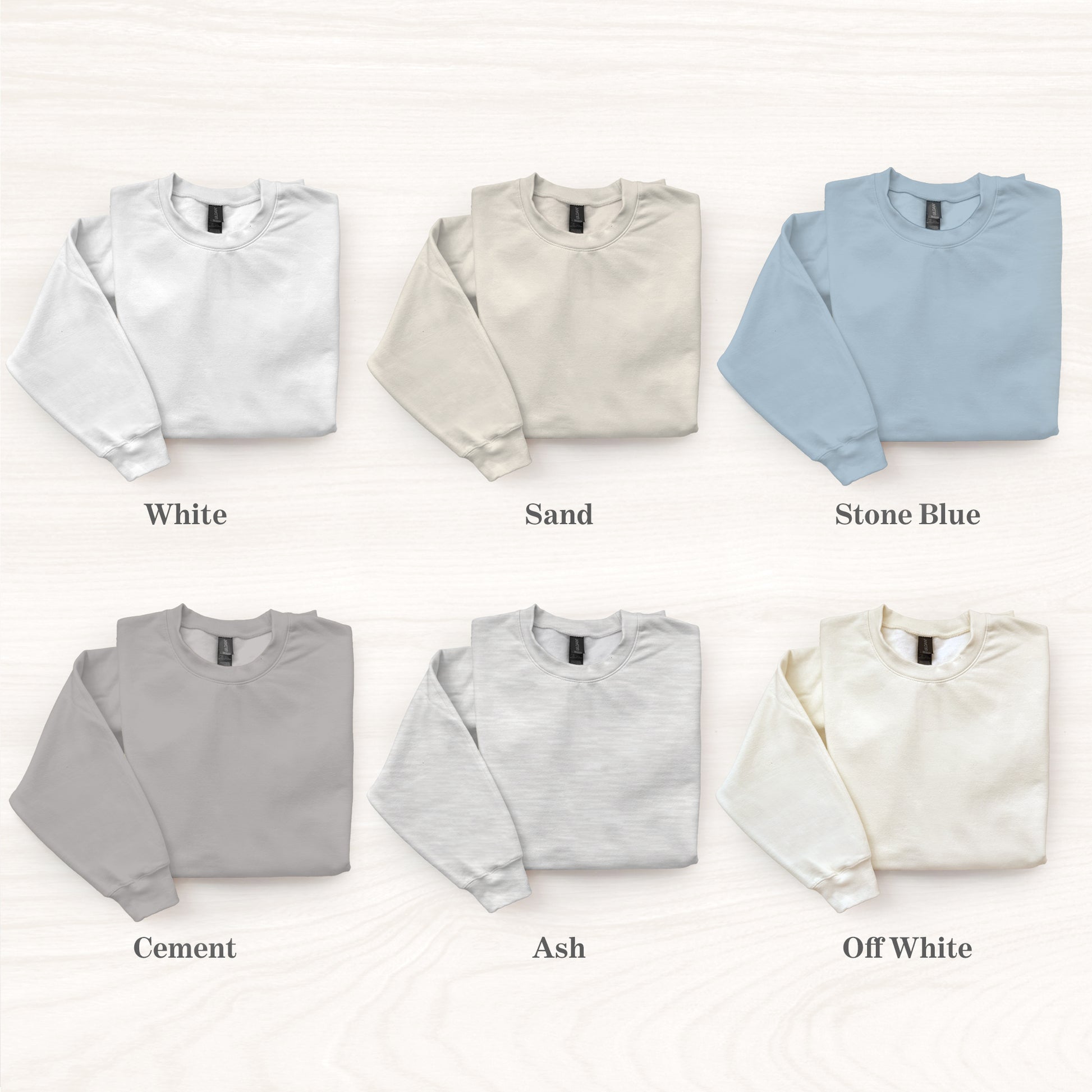 Collection of six sweatshirts in different colors on a white background
