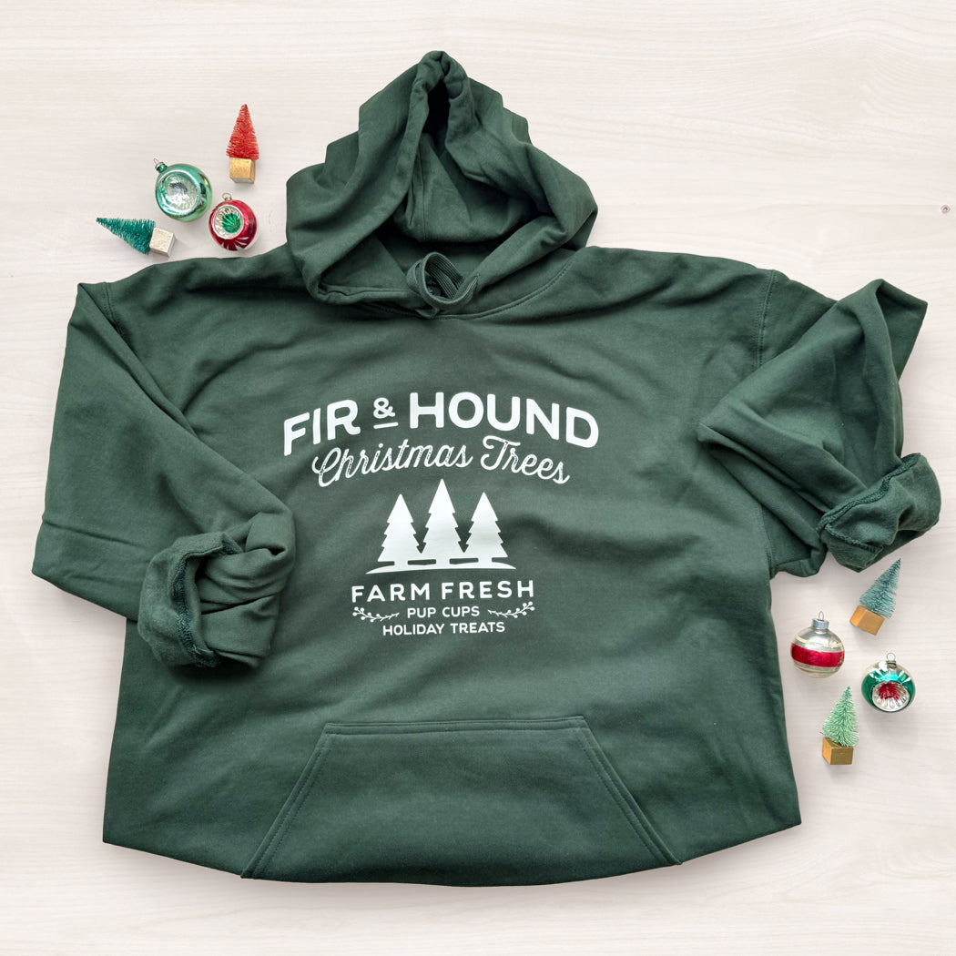 Green hoodie with 'Fir & Hound Christmas Trees' text on a white background