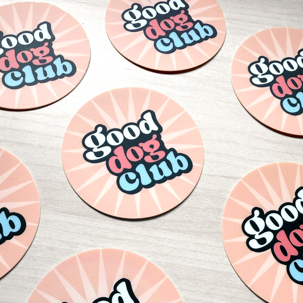 Pink round Good Dog Club vinyl sticker with retro lettering and sunburst design