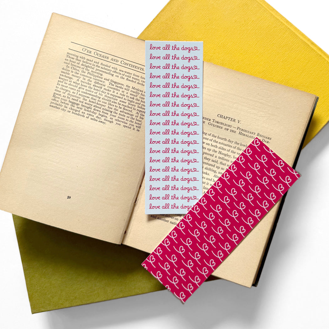Love All The Dogs bookmark with script type and a heart.