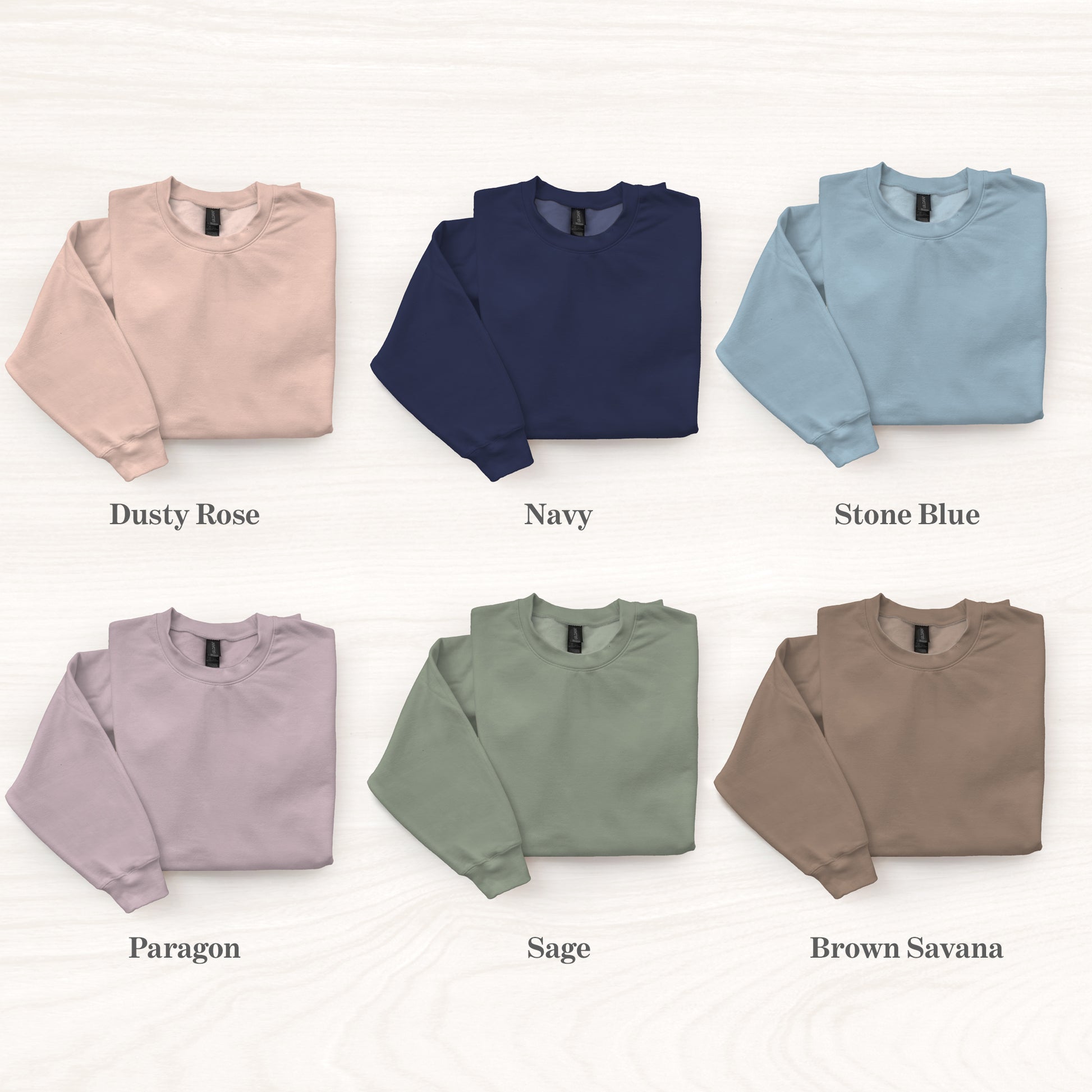 Collection of six sweatshirts in different colors with labels on a white background