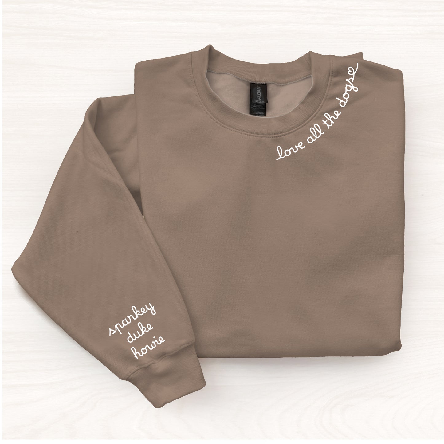 Folded brown sweatshirt with text on a white background