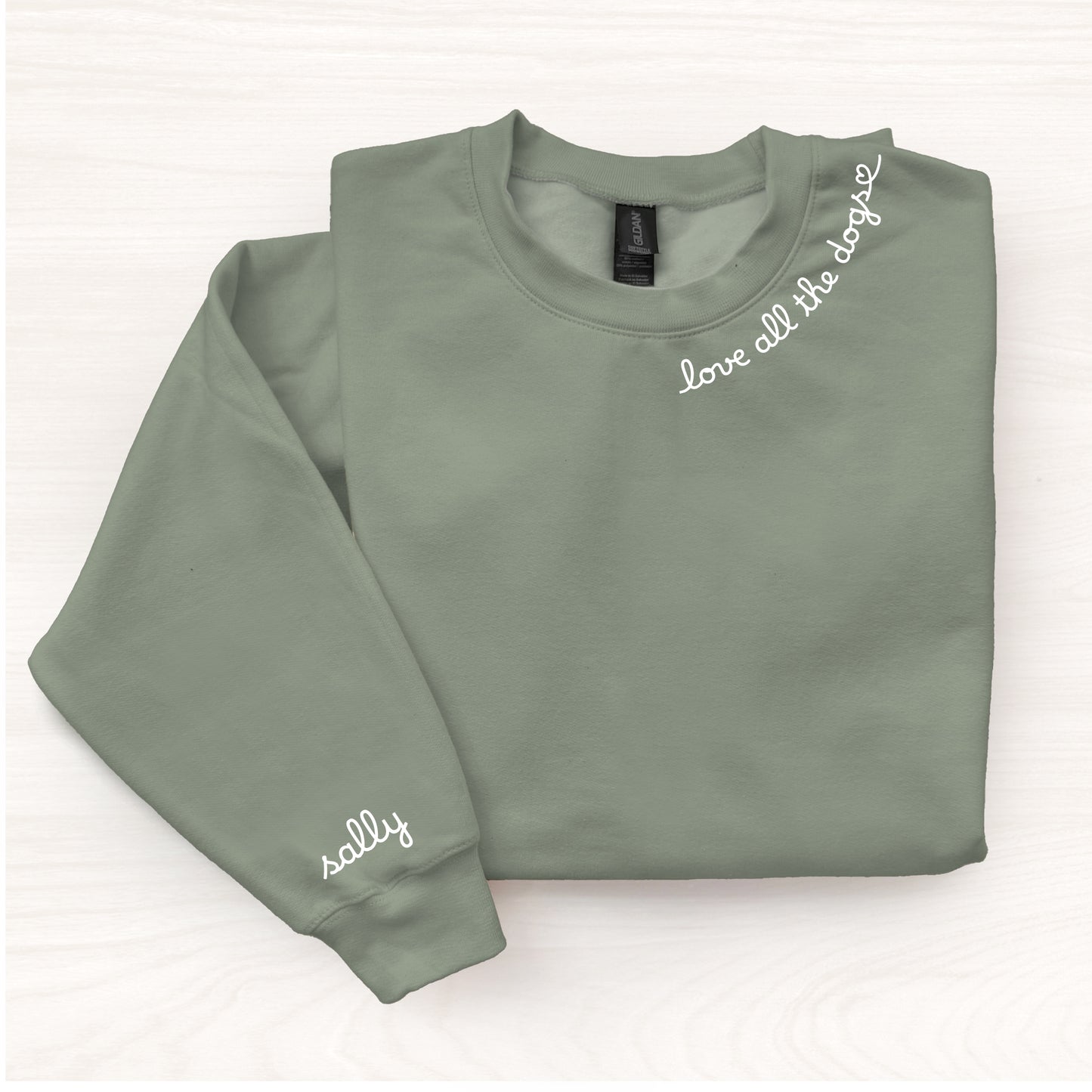 Folded green sweatshirt with text on a white background