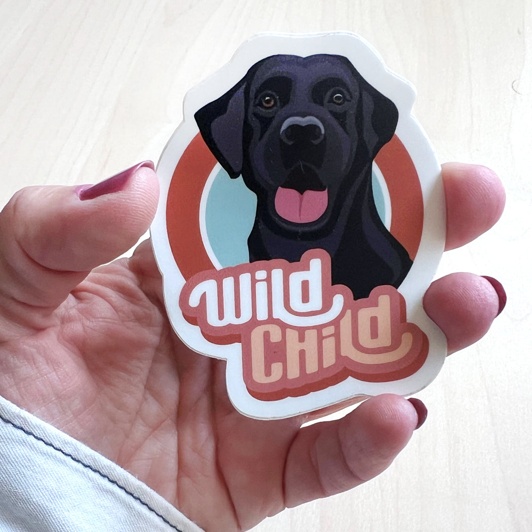 Wild Child Black Lab Dog Sticker – a waterproof vinyl decal featuring an adventurous black Labrador Retriever.