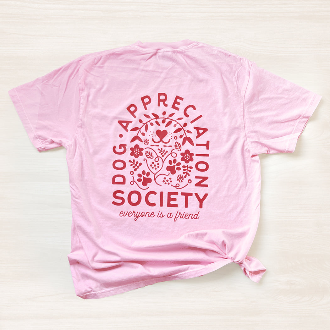 Back view of blossom pink Dog Appreciation Society Graphic T-Shirt with full graphic design.