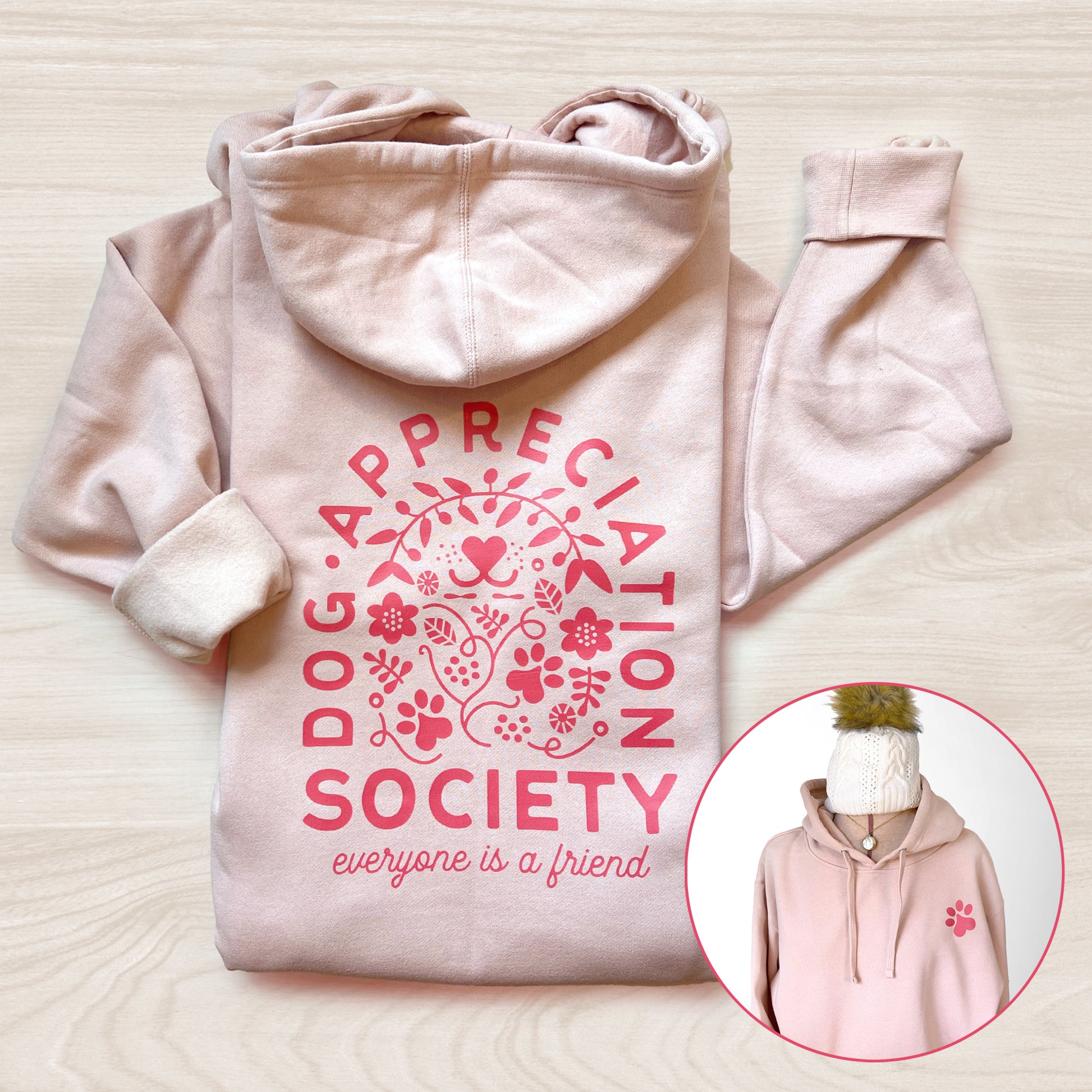 Back and front view of dusty pink Dog Appreciation Society Hoodie with hand-illustrated design.