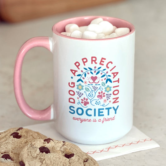 Front view of Dog Appreciation Society Mug with pink interior and handle.