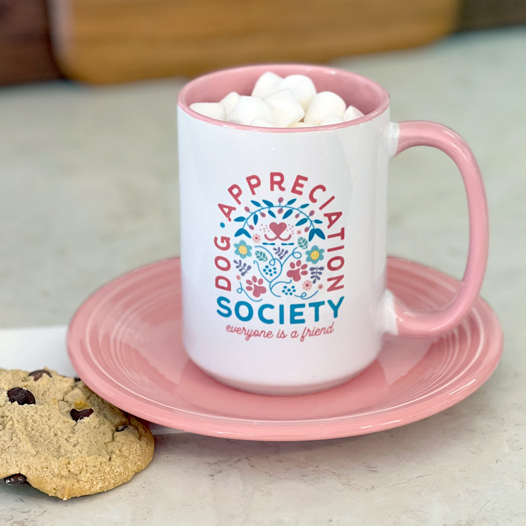 Front view of Dog Appreciation Society Mug with pink interior and handle.