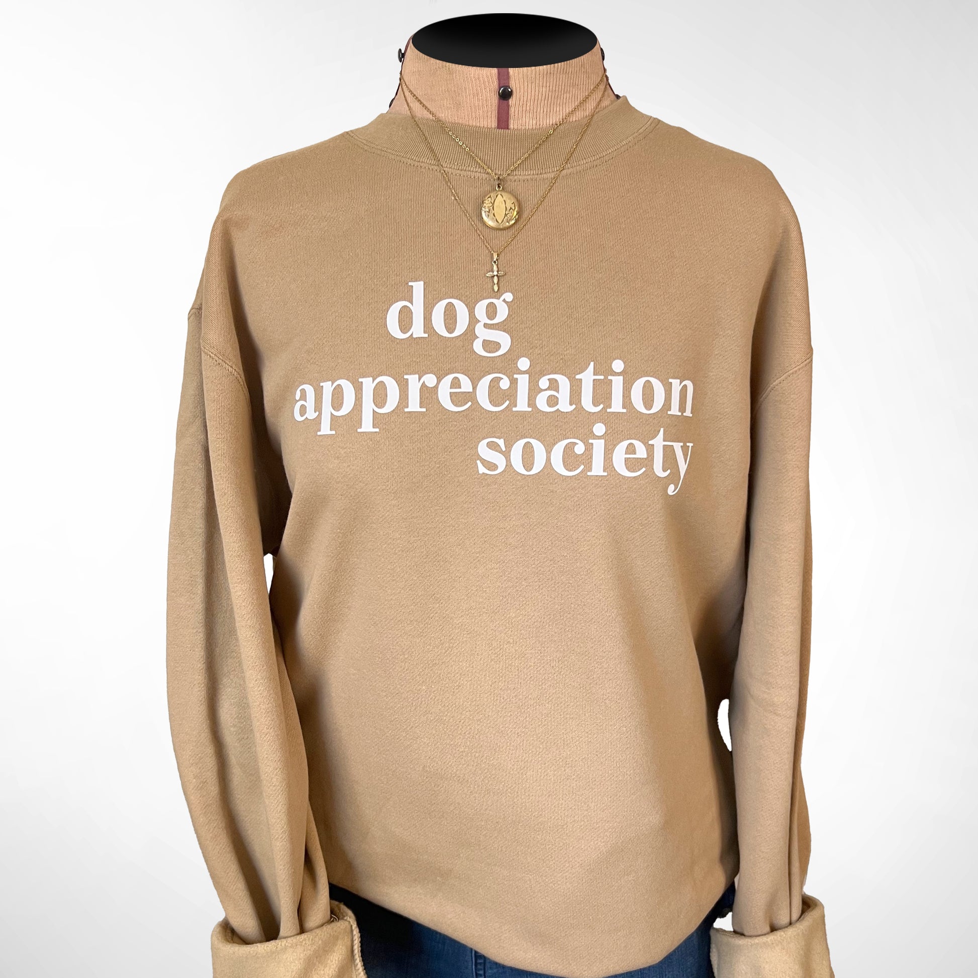 Front view of Dog Appreciation Society Sweatshirt in Sandstone color with white typography.