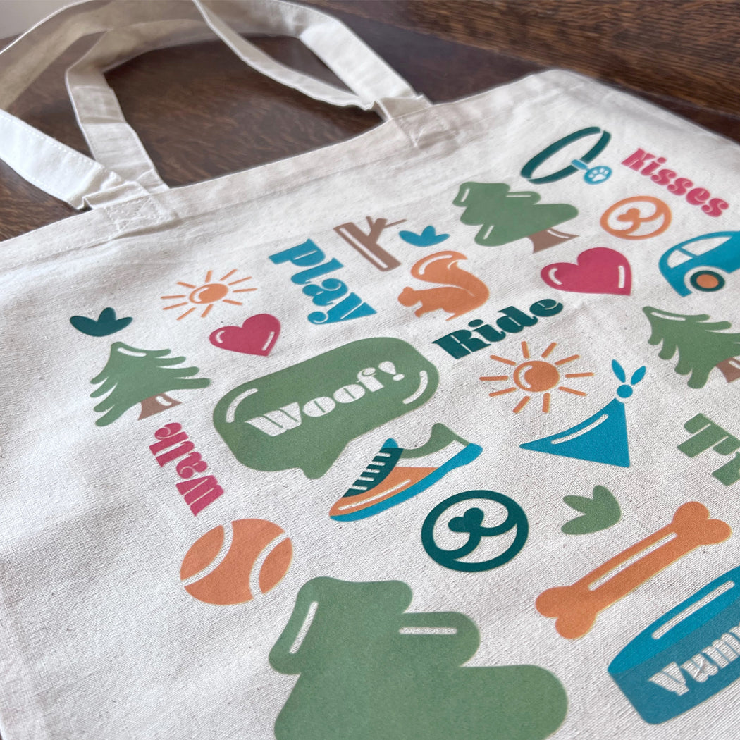 Front view of Dog Life Tote Bag featuring vibrant dog-themed pattern.