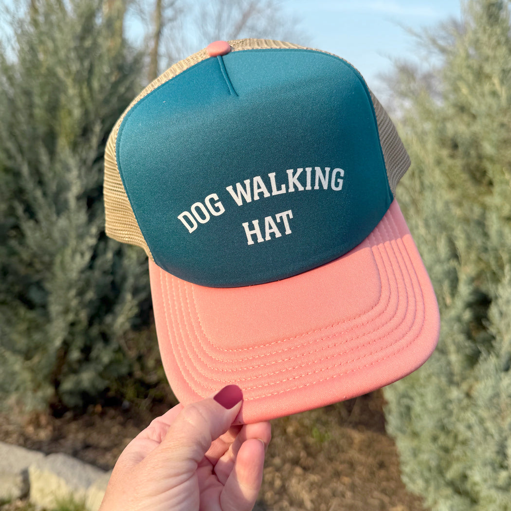Front view of tri-colored dog walking trucker hat with mesh back and slightly curved visor, designed for dog lovers