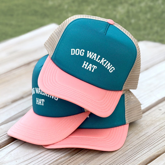 Front view of tri-colored dog walking trucker hat with mesh back and slightly curved visor, designed for dog lovers.