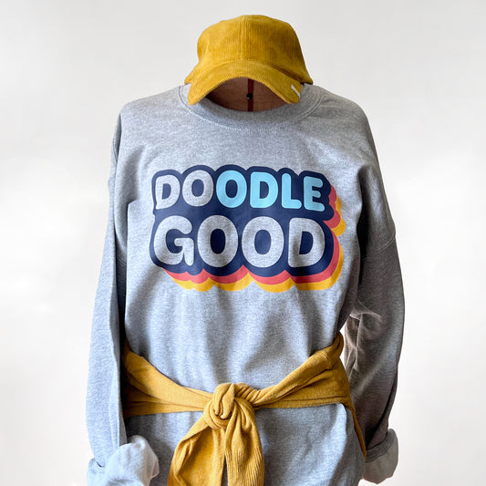 Gray unisex sweatshirt with 'Doodle Good. Do Good.' text, perfect for dog lovers and doodle owners.