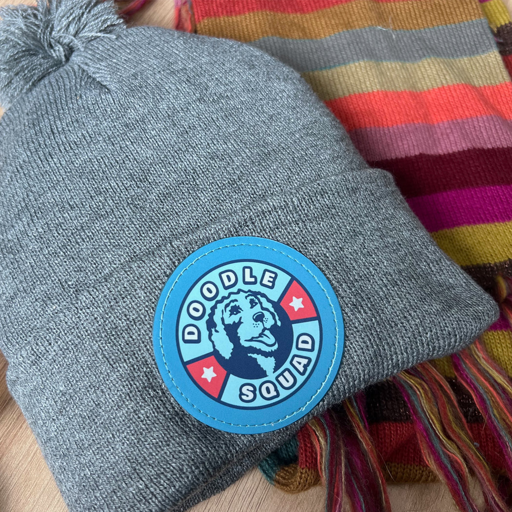 Doodle Squad Pom-Pom Knit Hat – cozy winter beanie for dog lovers.