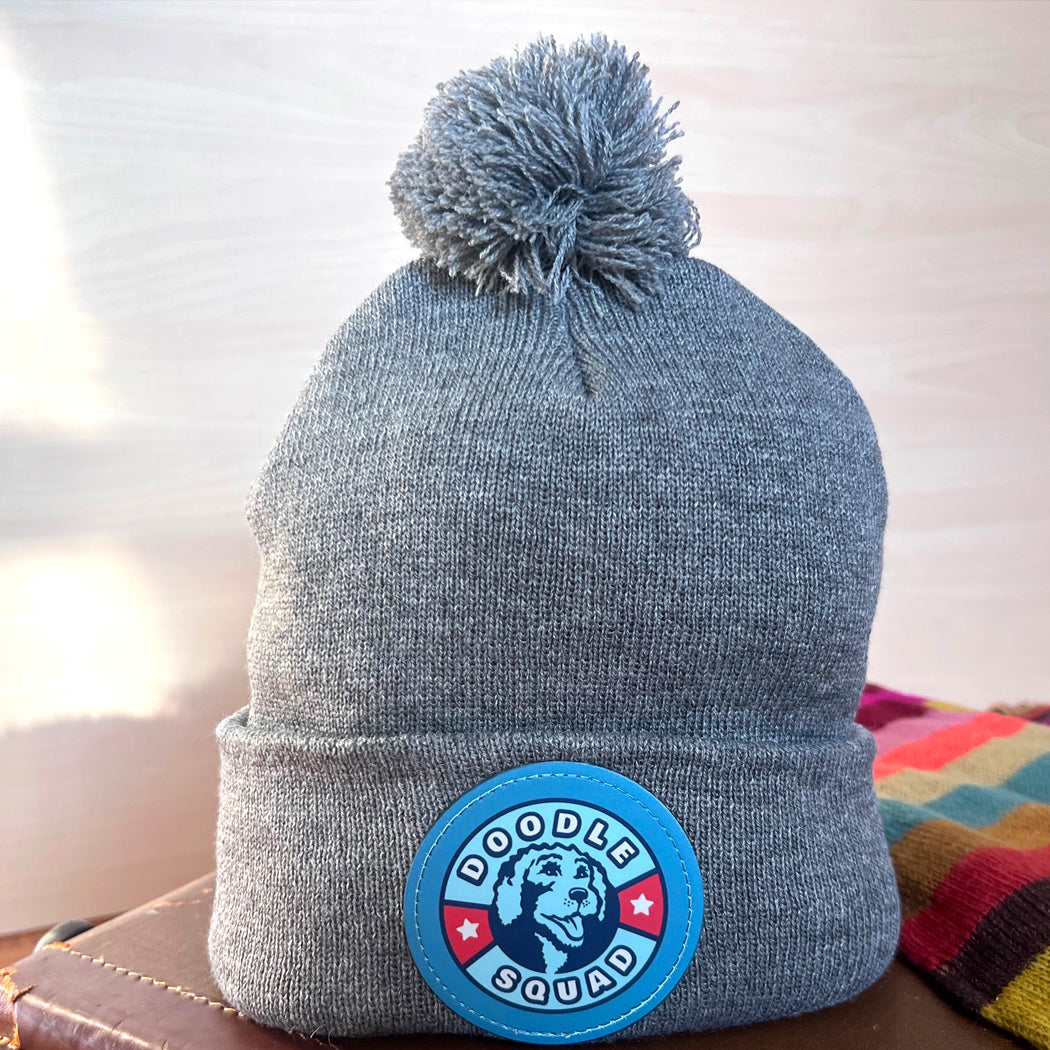 Doodle Squad Pom-Pom Knit Hat – cozy winter beanie for dog lovers.