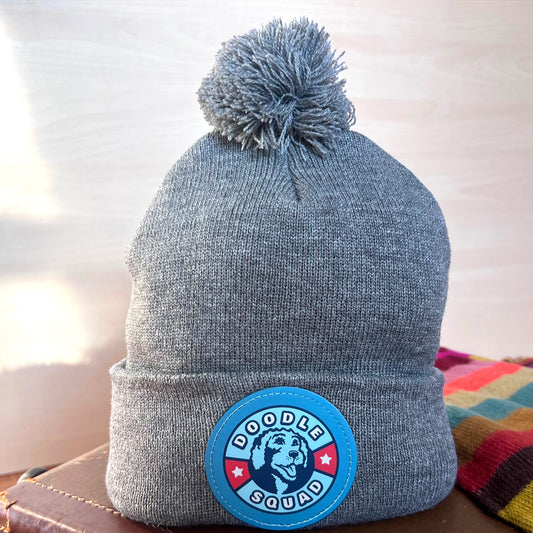 Doodle Squad Pom-Pom Knit Hat – cozy winter beanie for dog lovers.