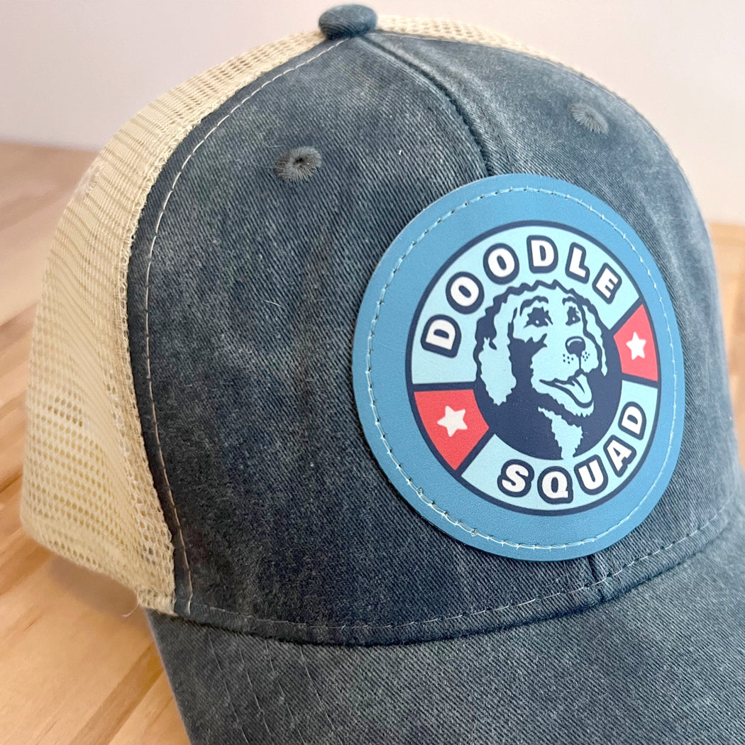 Breathable mesh back Doodle Squad trucker hat with adjustable snapback closure.