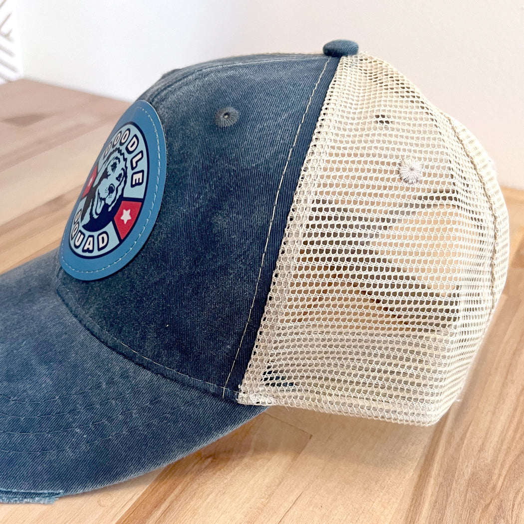 Breathable mesh back Doodle Squad trucker hat with adjustable snapback closure.