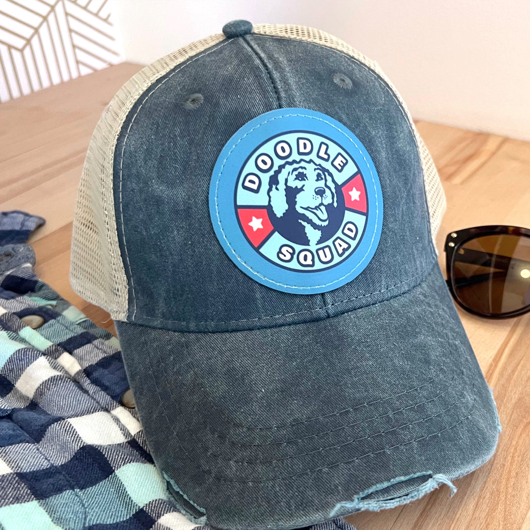 Breathable mesh back Doodle Squad trucker hat with adjustable snapback closure.
