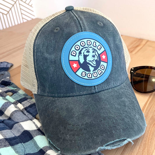 Breathable mesh back Doodle Squad trucker hat with adjustable snapback closure.
