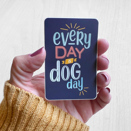 Blue sticker with fun colorful type that says "Everyday is Dog Day"