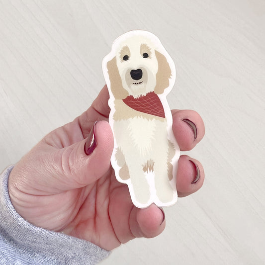 Doodle dog sticker featuring a cream-colored dog wearing a red bandana.