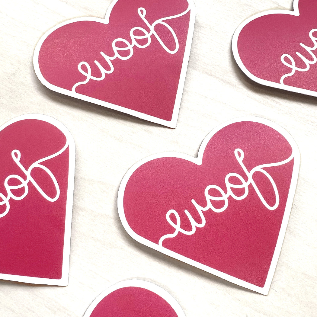 Adorable heart dog sticker featuring ‘woof’ text, ideal for pet lovers and dog owners.