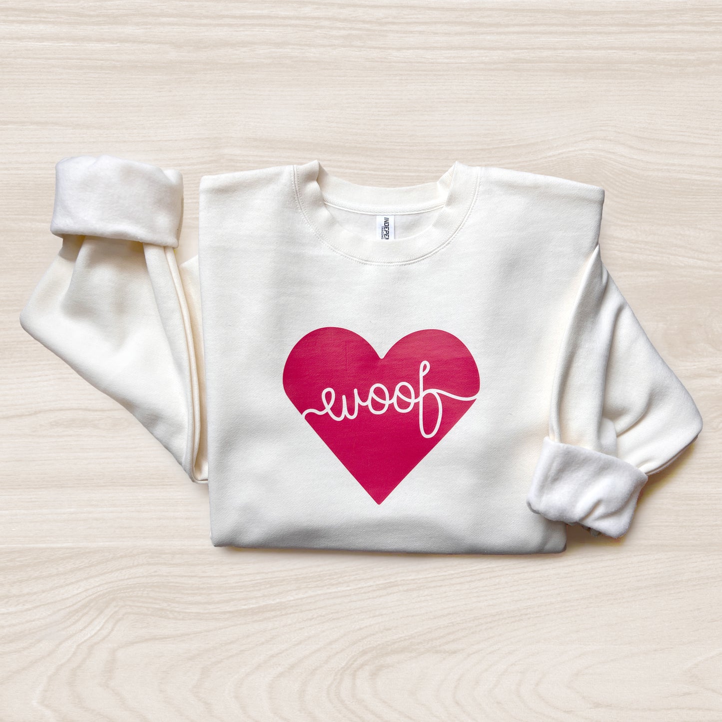 Adorable dog-themed sweatshirt with ‘Woof Heart’ design, a great gift for pet lovers.