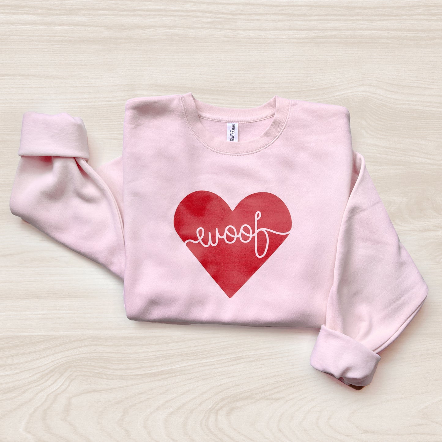 Adorable dog-themed sweatshirt with ‘Woof Heart’ design, a great gift for pet lovers.