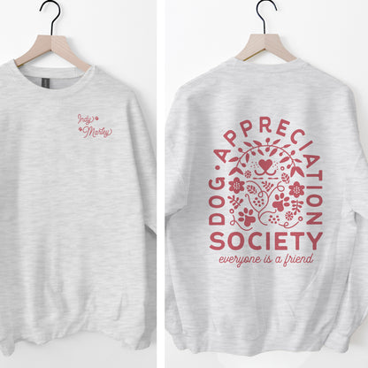 Gray sweatshirt with pink 'Dog Appreciation Society' design on a white background