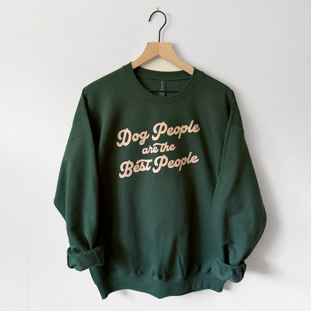 Green sweatshirt with 'Dog People are the Best People' text on a hanger against a white background