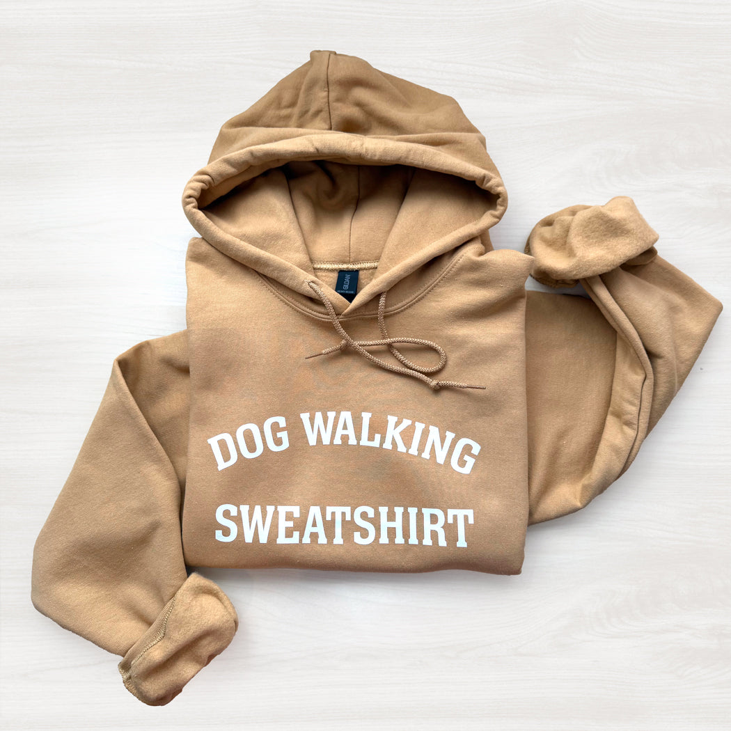 Cozy unisex hoodie with “Dog Walking Sweatshirt” graphic in white letters