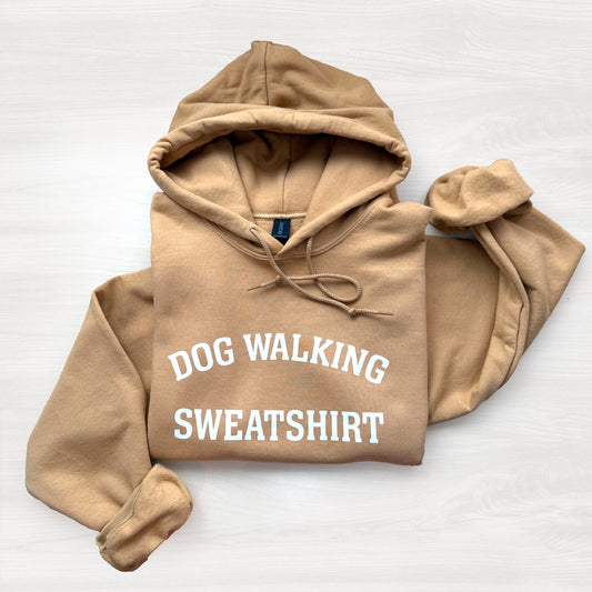 Cozy unisex hoodie with “Dog Walking Sweatshirt” graphic in white letters
