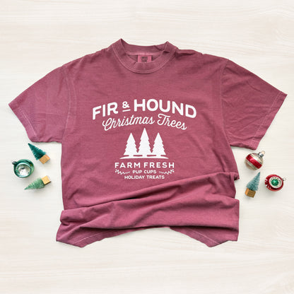 Maroon t-shirt with white text and graphics on a light background