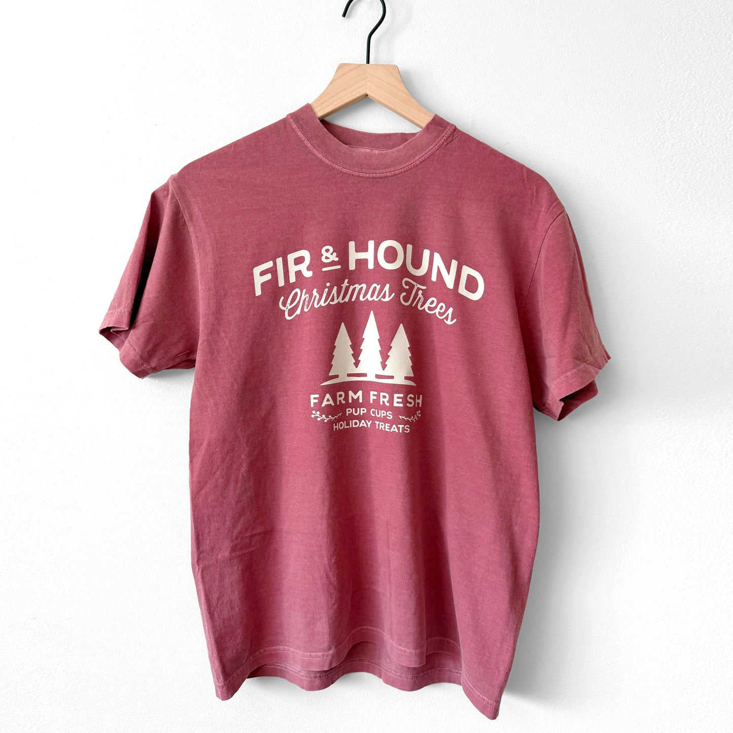 Red t-shirt with 'Fir & Hound Christmas Trees' print on a white background