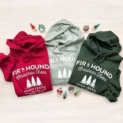 Three hoodies in red, sage, and forest green with 'Fir & Hound Christmas Trees' graphic.