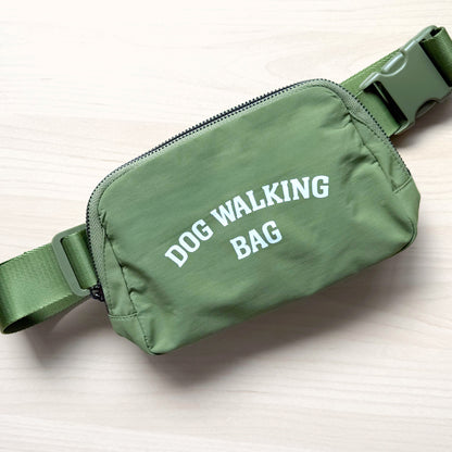 Dog Walking Bag shown in green with adjustable strap and front zipper pocket