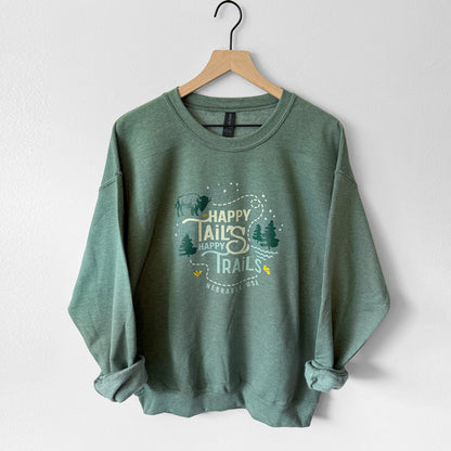 Green sweatshirt with 'Happy Trails' text on a hanger against a white background