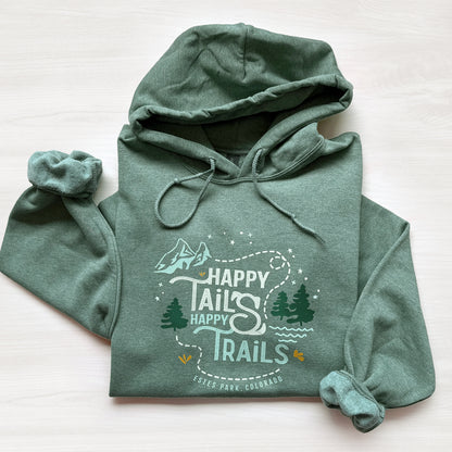 Green hoodie with 'Happy Tails Happy Trails' text and graphics on a white background
