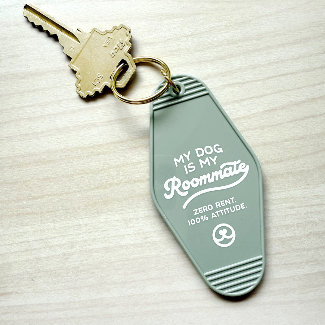 Close-up of funny dog quote keychain perfect gift for pet parents