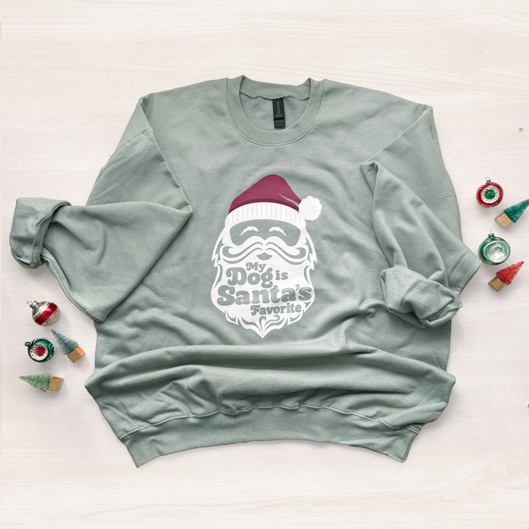 Light green sweatshirt with Santa graphic and text on a white background
