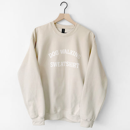 Beige sweatshirt with 'DOG WALKING SWEATSHIRT' text on a white background
