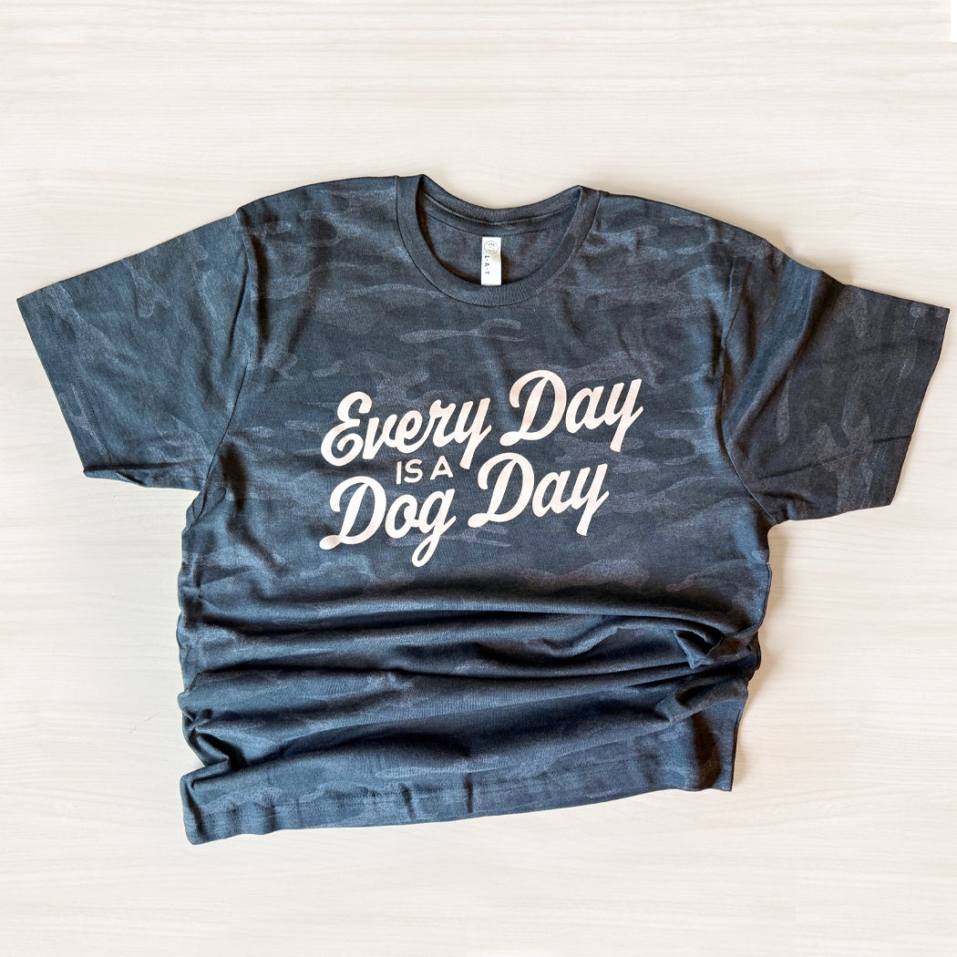 Blue t-shirt with 'Every Day is a Dog Day' text on a white background