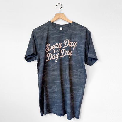 Blue t-shirt with 'Every Day is a Dog Day' text on a hanger against a white background