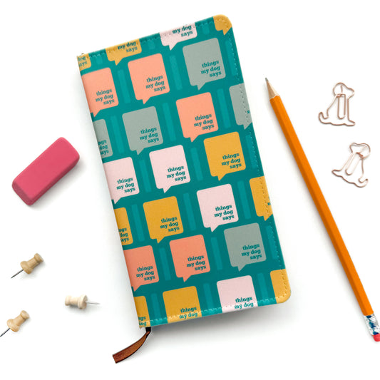 Notebook with colorful text pattern on a white background